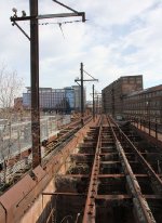 Looking at the dual gauge ROW. Note the overhead wire to power the railcars.